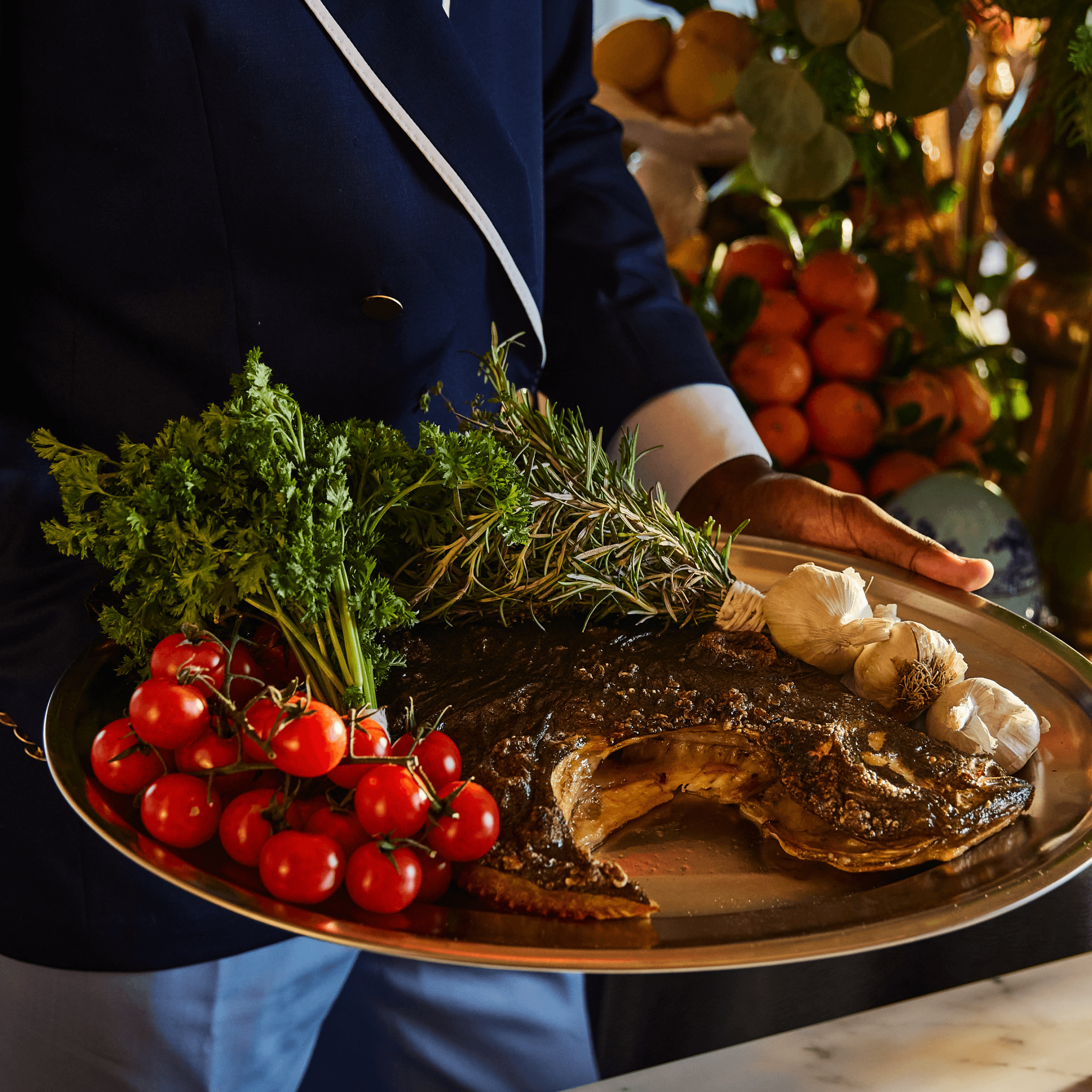 Captain holding Whole Fish